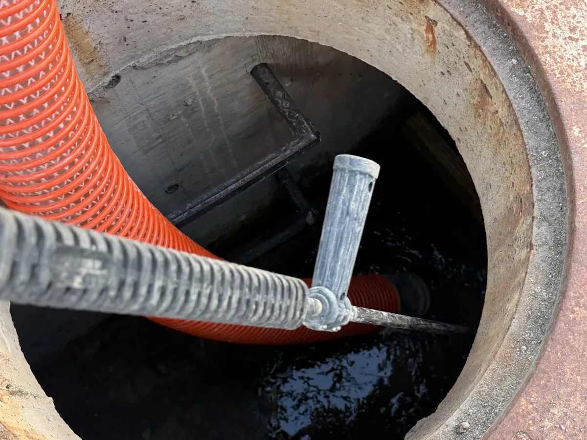 Vacuum truck hose cleaning out a storm drain catch basin in Colorado Vacuum truck hose cleaning out a storm drain catch basin in Colorado